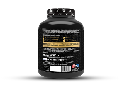 Back label of the Corebolics Monster Mass gainer tub showing product description, key features, directions for use, warning, manufacturer details and FSSAI license